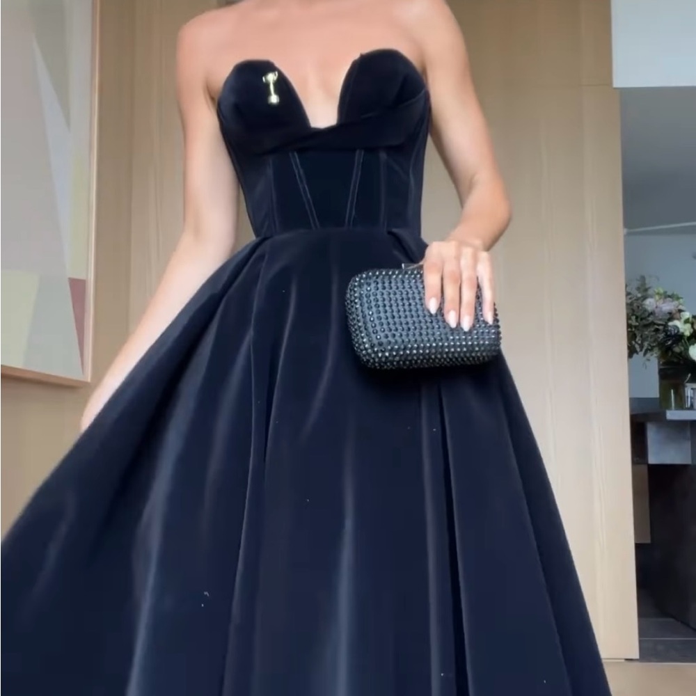 Black drenhussa xharra gown. Low cut velvet. Heavy tuille skirt padding.